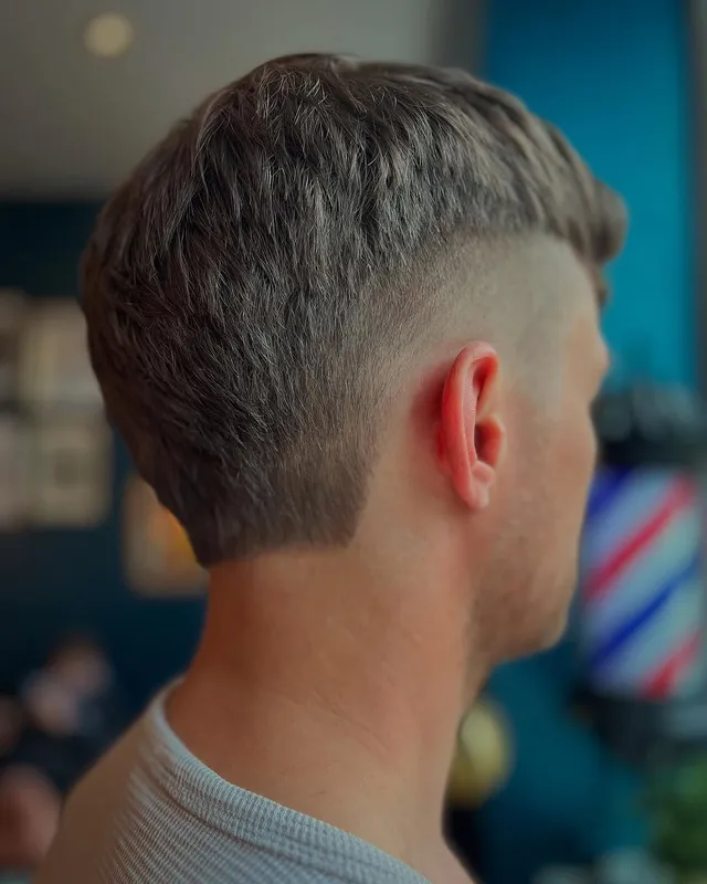 A textured French crop with a skin fade