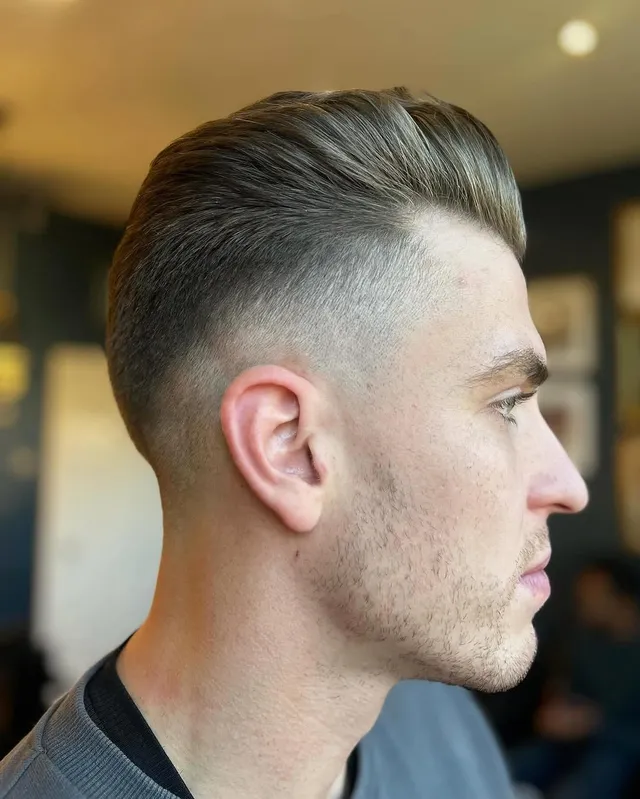 A slick-back with a high skin fade