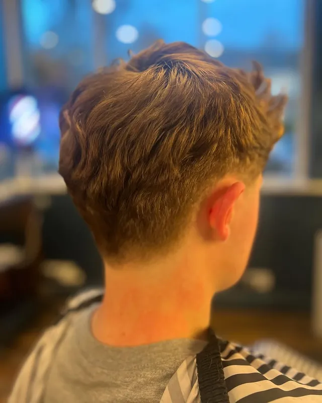 A textured quiff finished with a clean taper