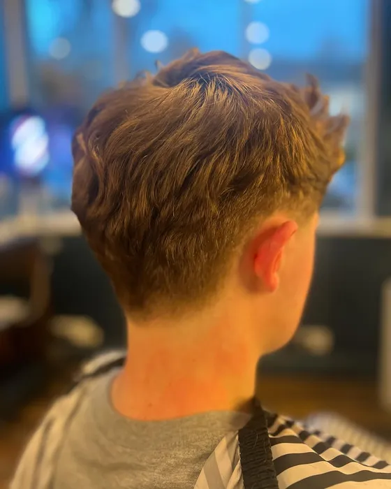 A textured cut finished with a low taper at Butler’s Barbering