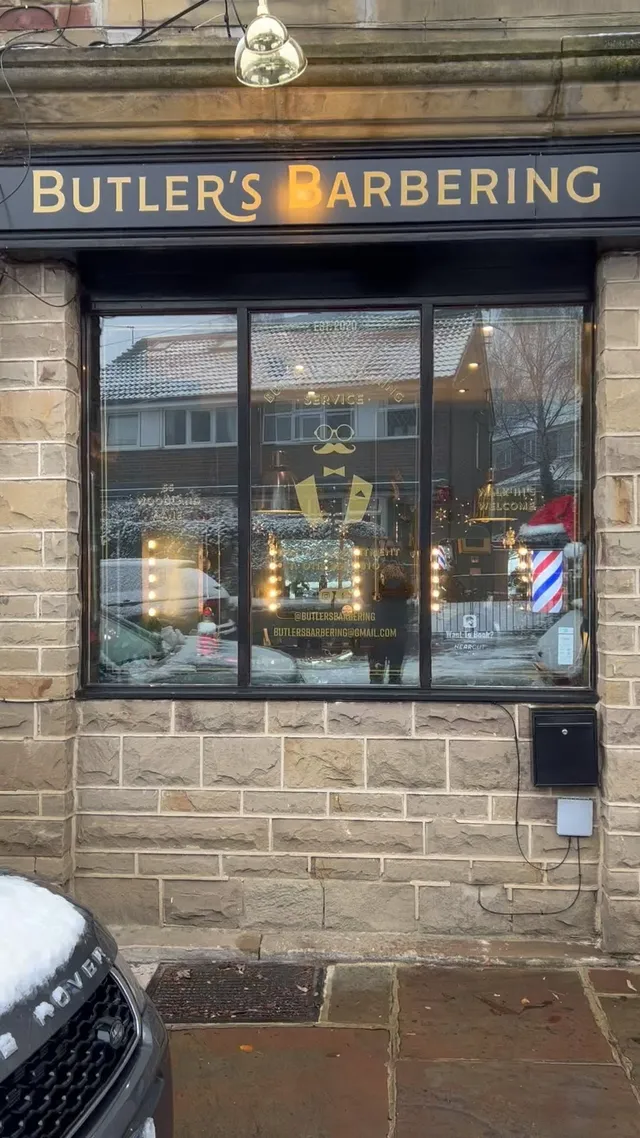 The Butler’s Barbering window on a snowy morning